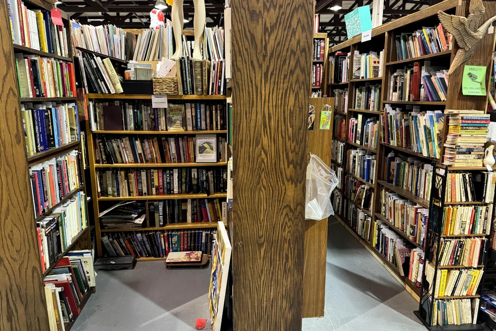 Floor to ceiling bookshelves filling a booth
