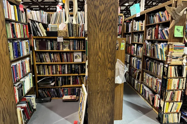 Floor to ceiling bookshelves filling a booth