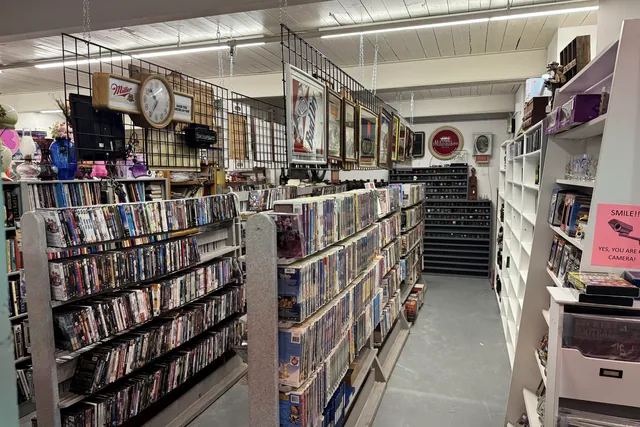 An aisle of shelved discs, tapes and media cases